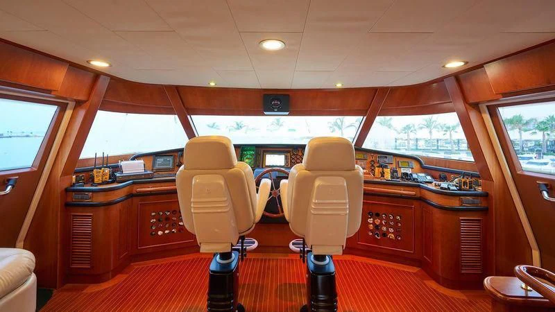 a room with a chair and a desk aboard IMAGINE Yacht for Charter