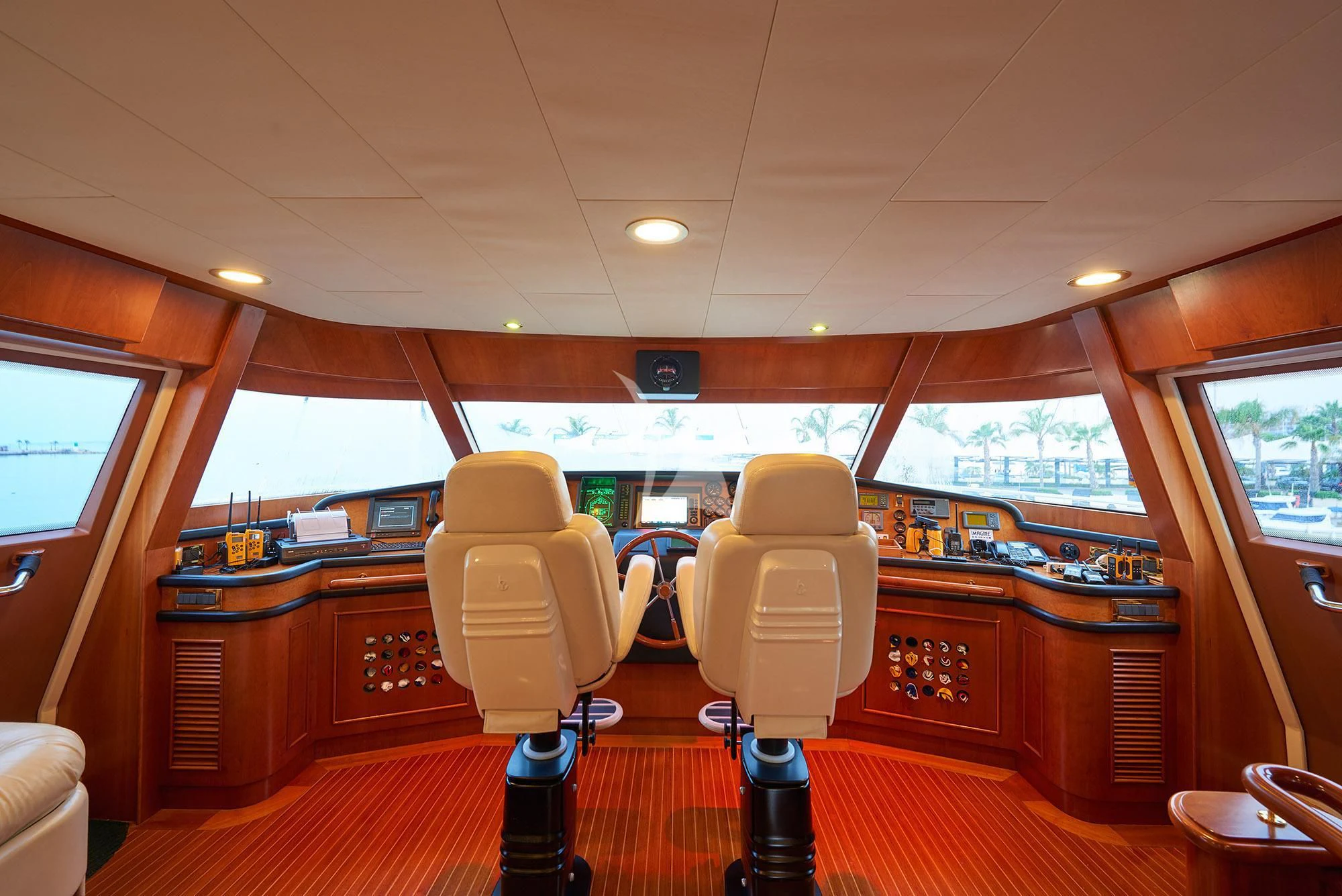 a room with a desk and chairs aboard IMAGINE Yacht for Charter