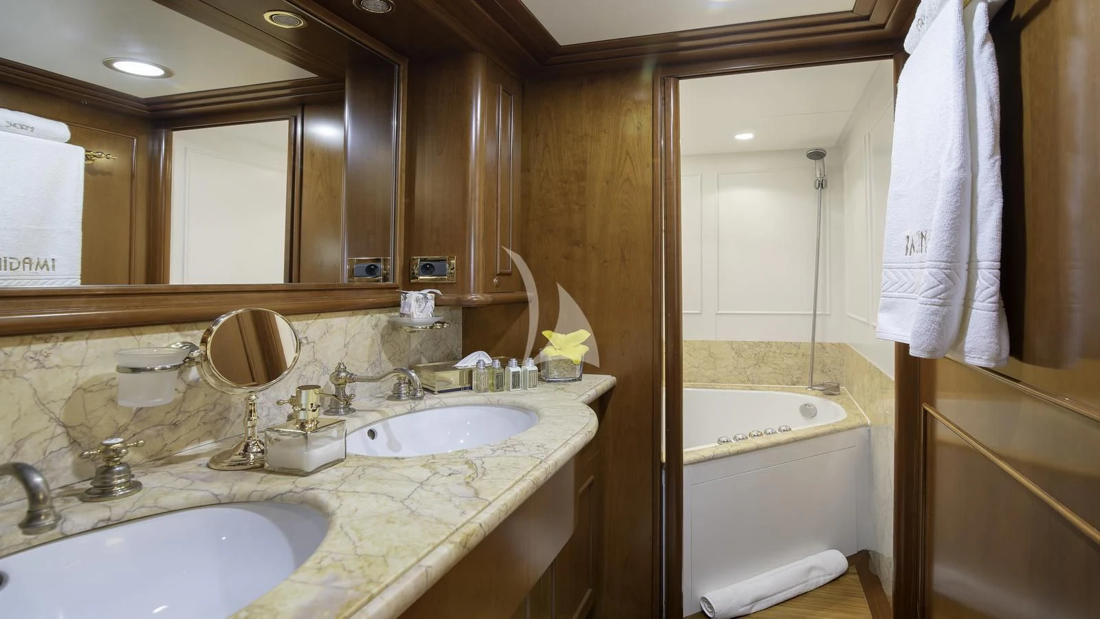 a bathroom with a sink and a bathtub aboard IMAGINE Yacht for Charter