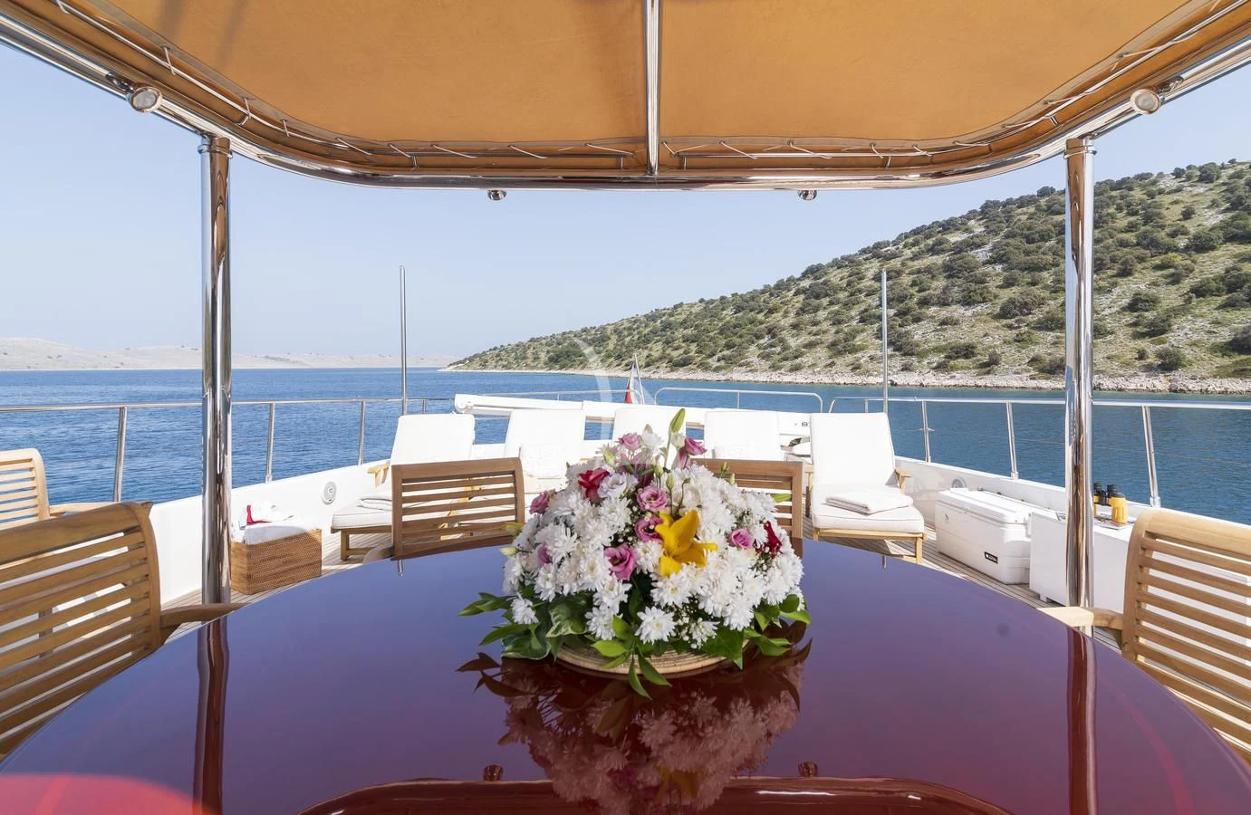 a flower arrangement on a table aboard IMAGINE Yacht for Charter