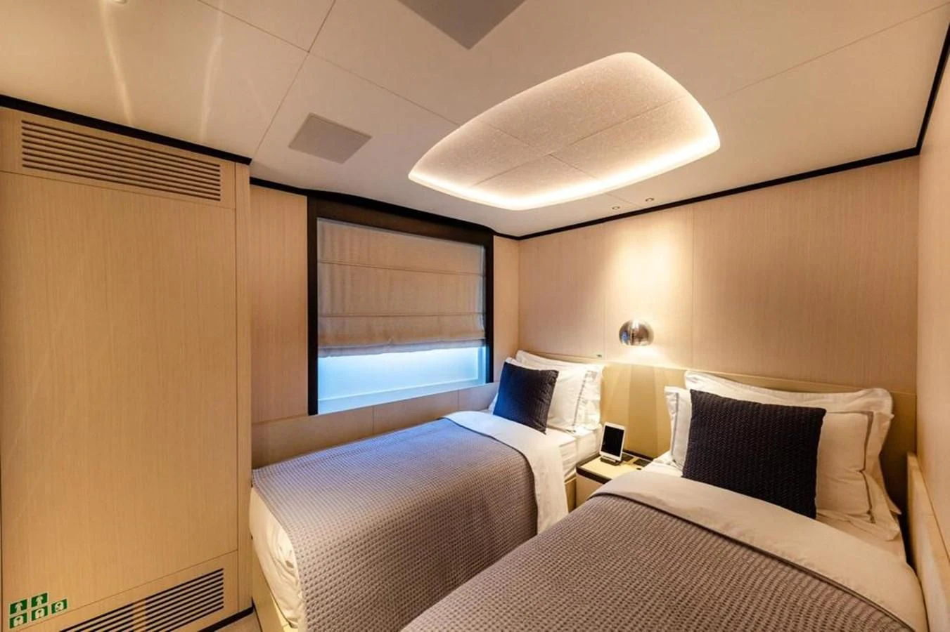 a room with two beds aboard UNDICI Yacht for Sale