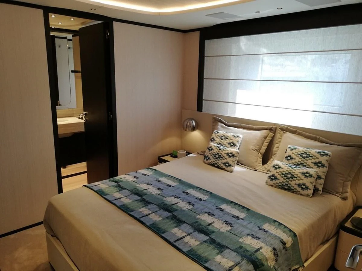 a bed with pillows aboard UNDICI Yacht for Sale
