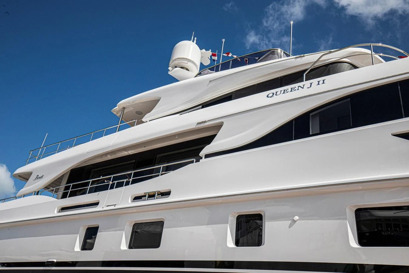 a white yacht with a white tower aboard UNDICI Yacht for Sale