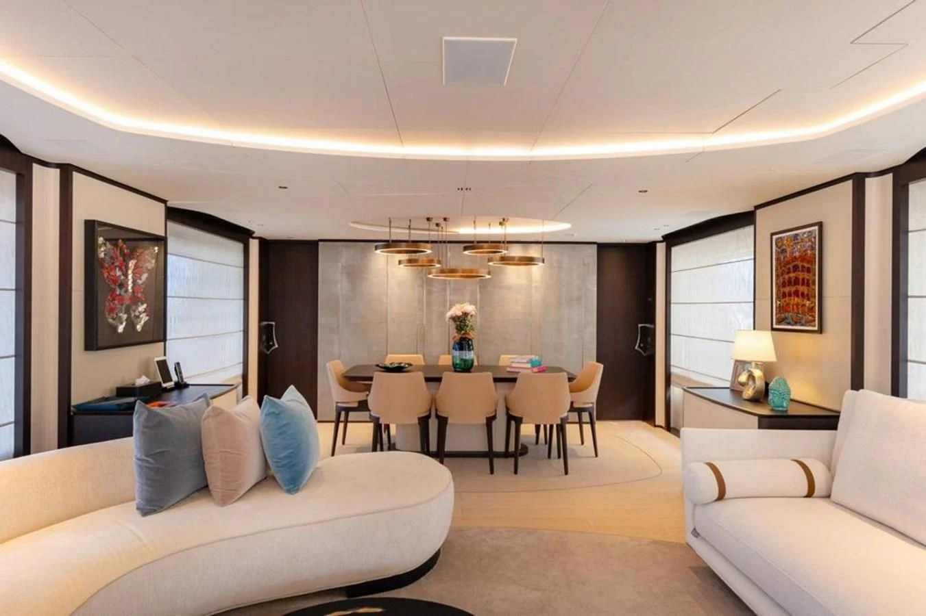a living room with a couch and a table aboard UNDICI Yacht for Sale
