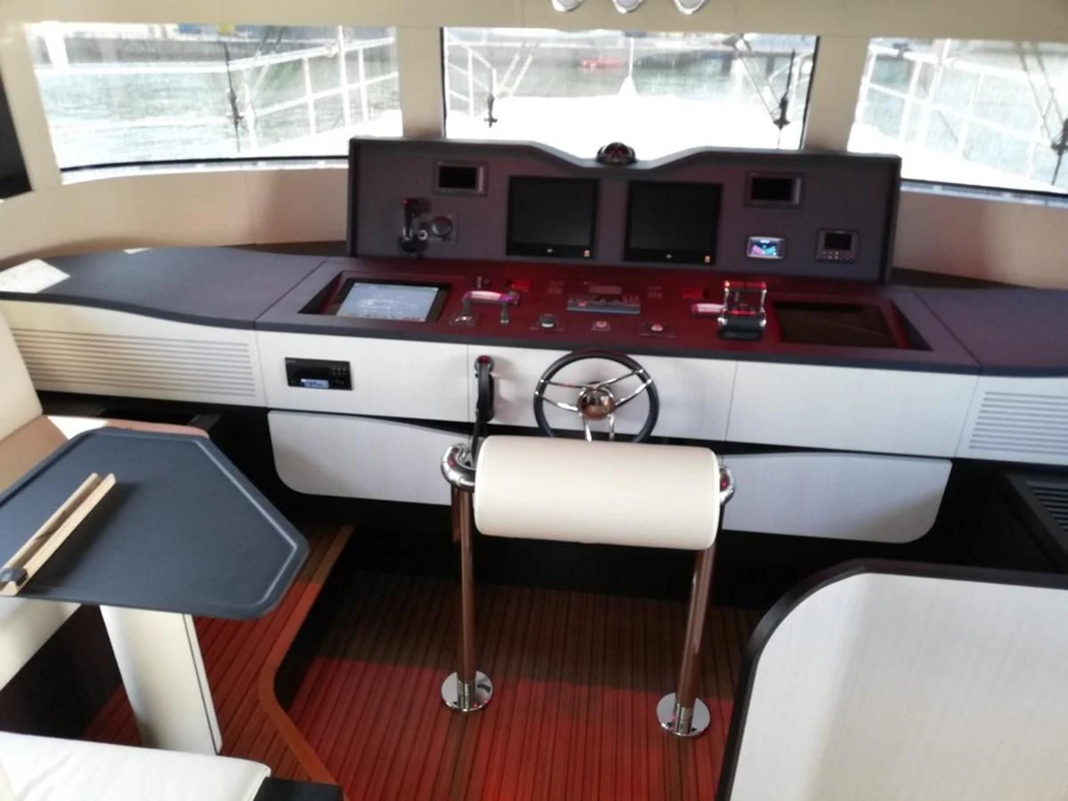 a red and black machine aboard UNDICI Yacht for Sale