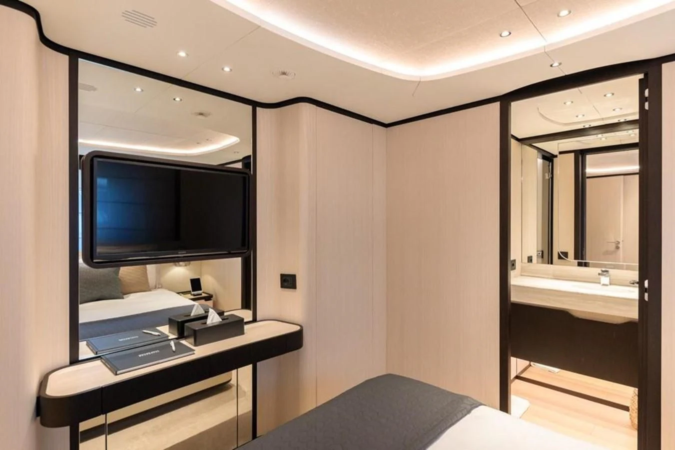 a room with a desk and a tv aboard UNDICI Yacht for Sale