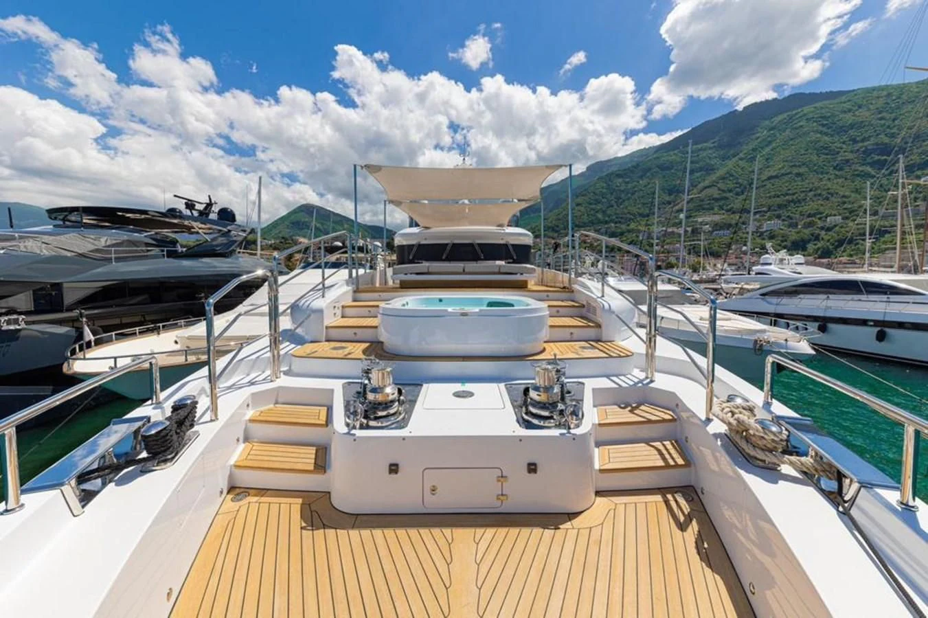 a deck with a boat on it aboard UNDICI Yacht for Sale