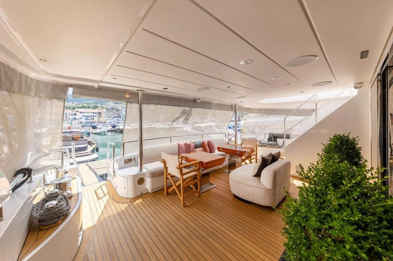 a living room with a large patio aboard UNDICI Yacht for Sale
