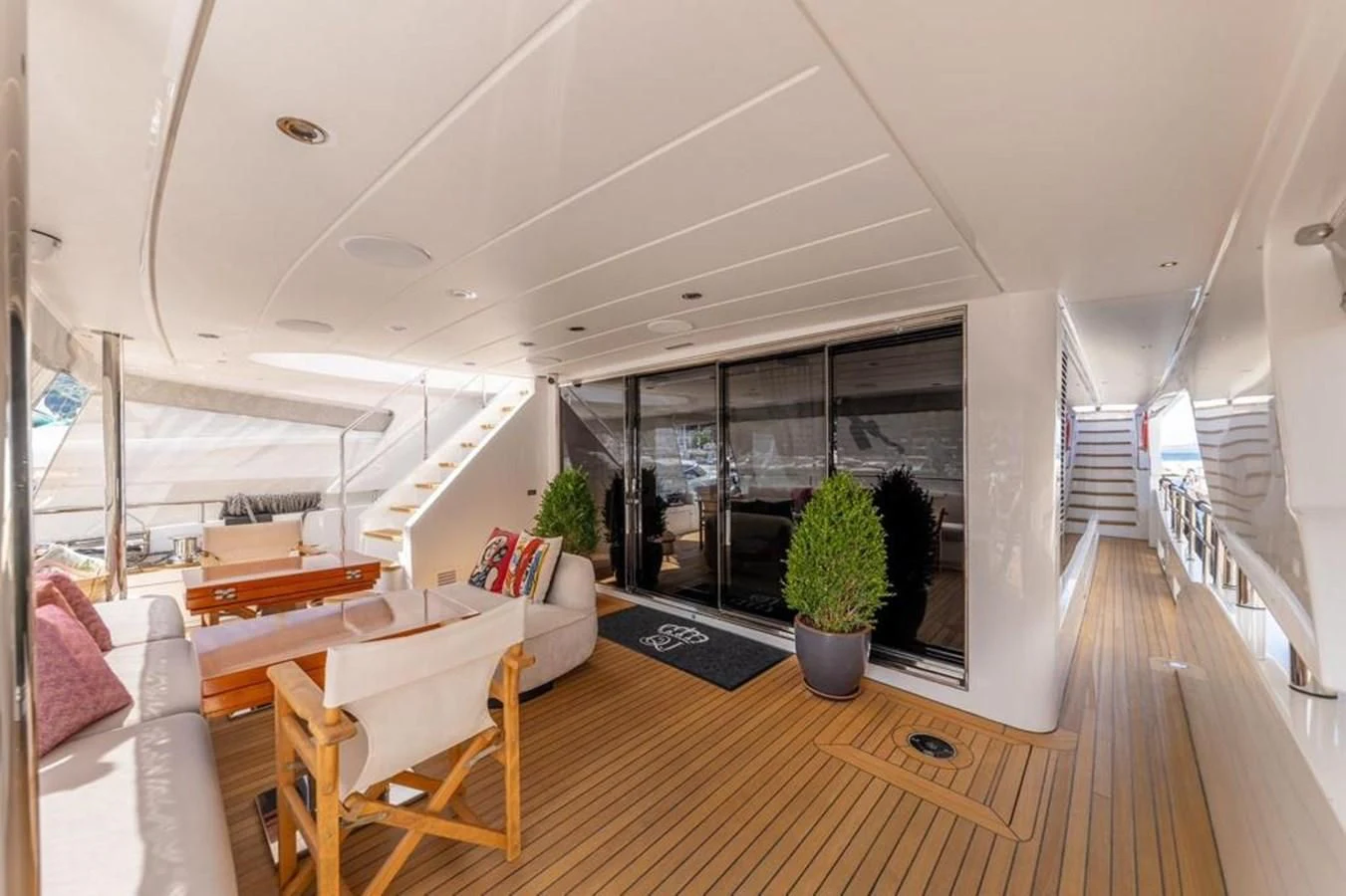 a modern house with a large balcony aboard UNDICI Yacht for Sale