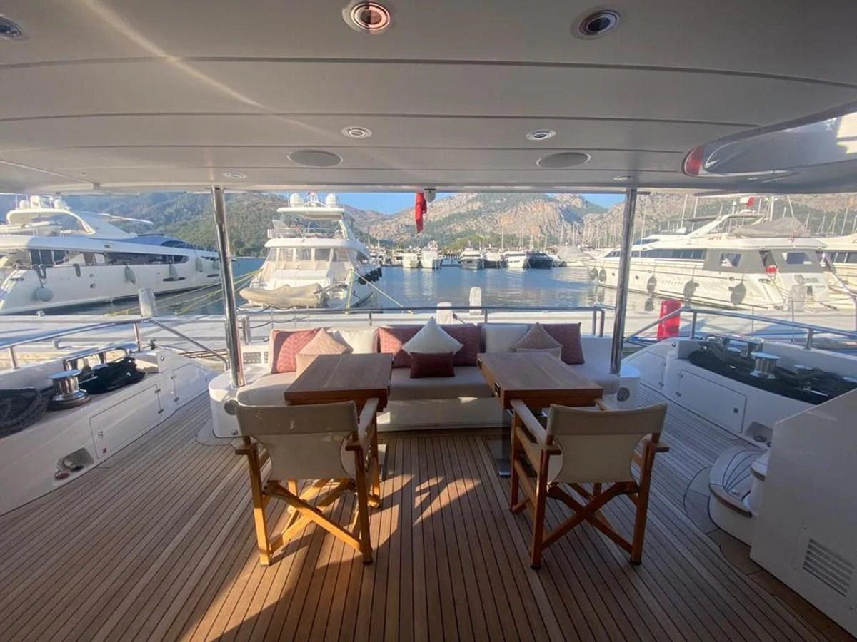 a room with a view of the water and boats aboard UNDICI Yacht for Sale