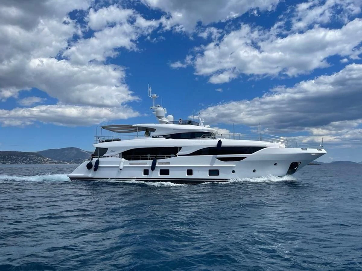 a white yacht in the water aboard UNDICI Yacht for Sale