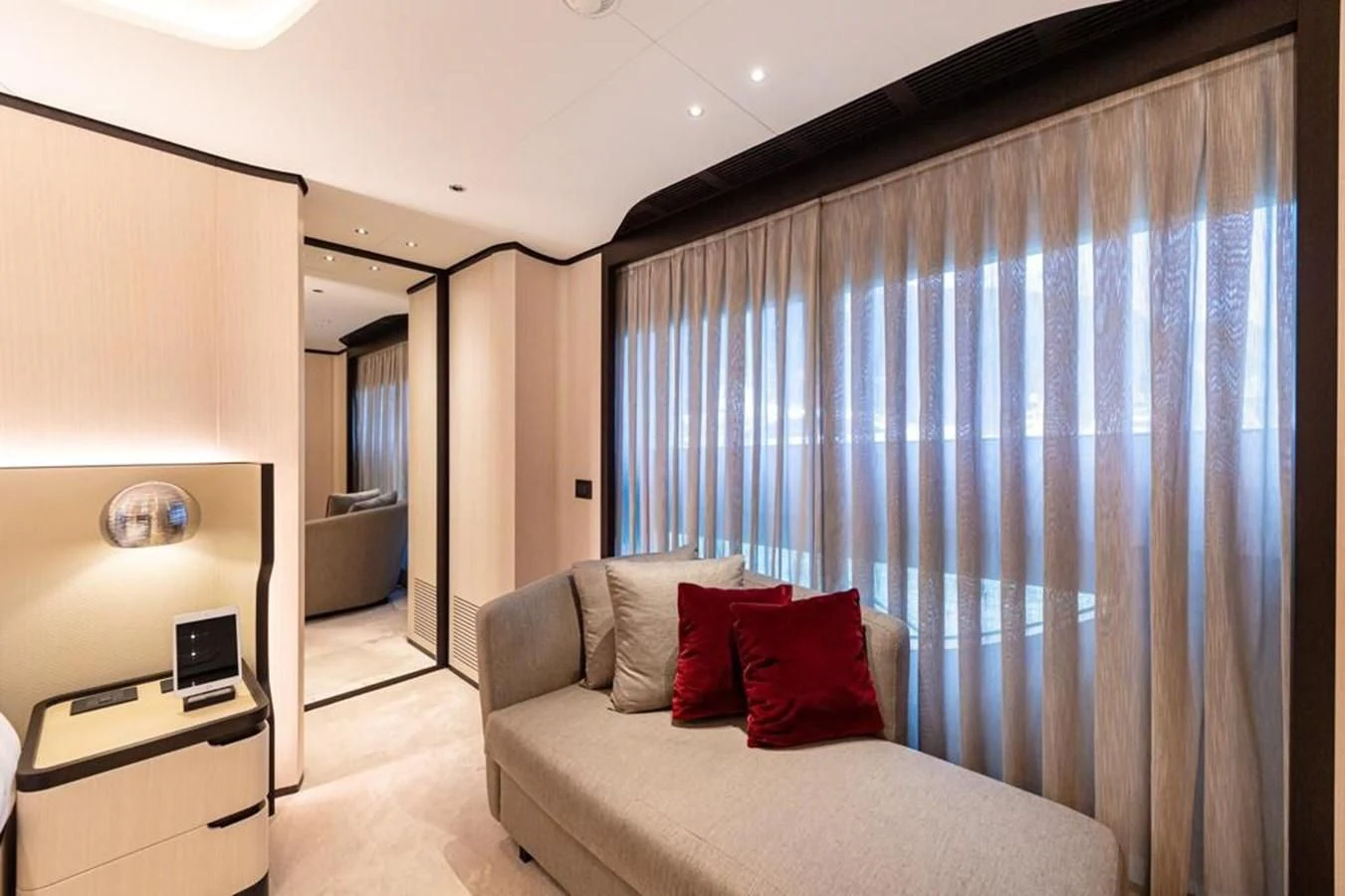a bedroom with a bed and a desk aboard UNDICI Yacht for Sale