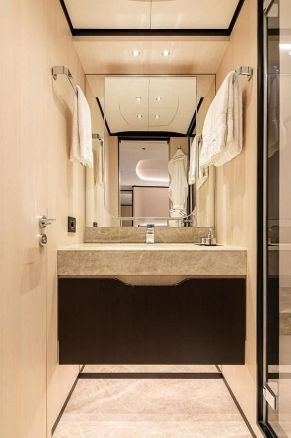a bathroom with a large mirror aboard UNDICI Yacht for Sale