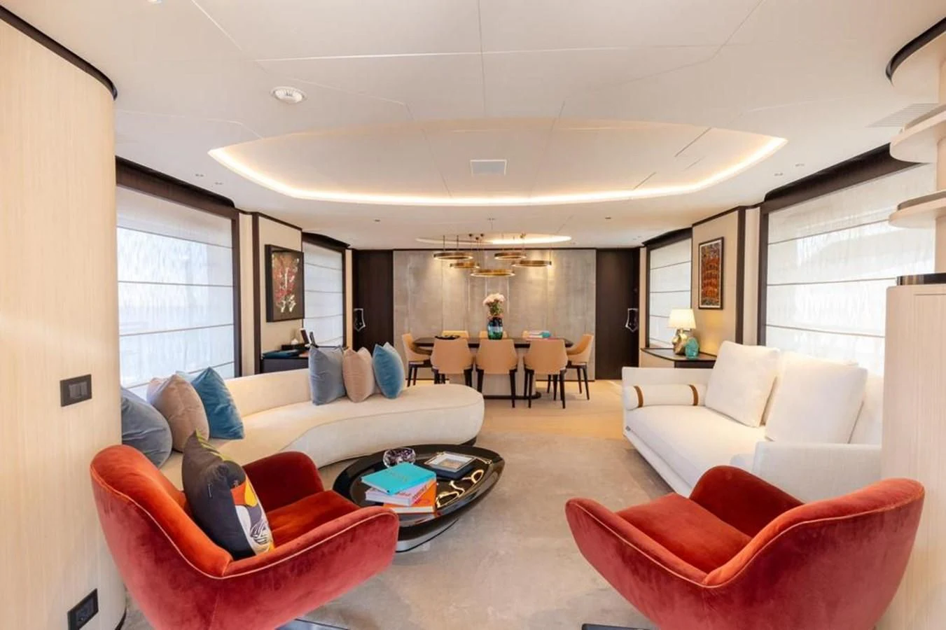 a living room with a couch and a table aboard UNDICI Yacht for Sale