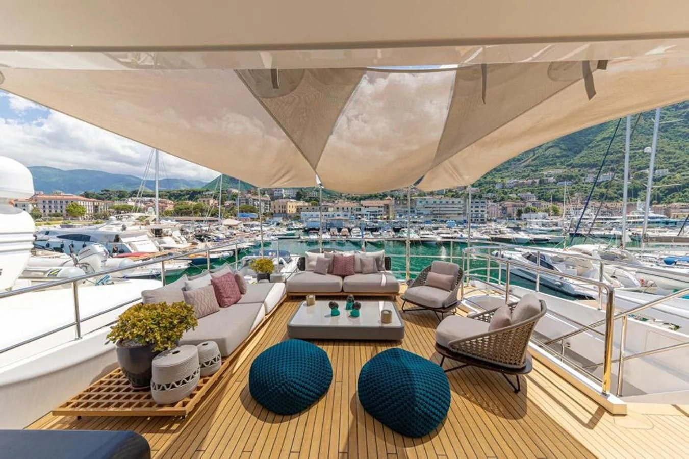 a room with a view of a city and a large body of water aboard UNDICI Yacht for Sale