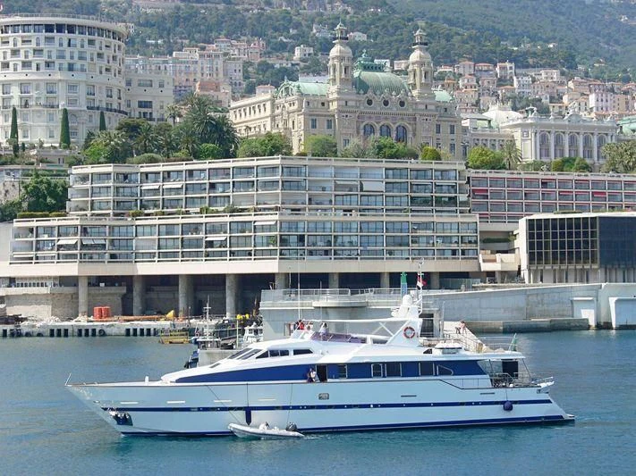 a large cruise ship in front of a large building aboard AZURE RHAPSODY Yacht for Sale