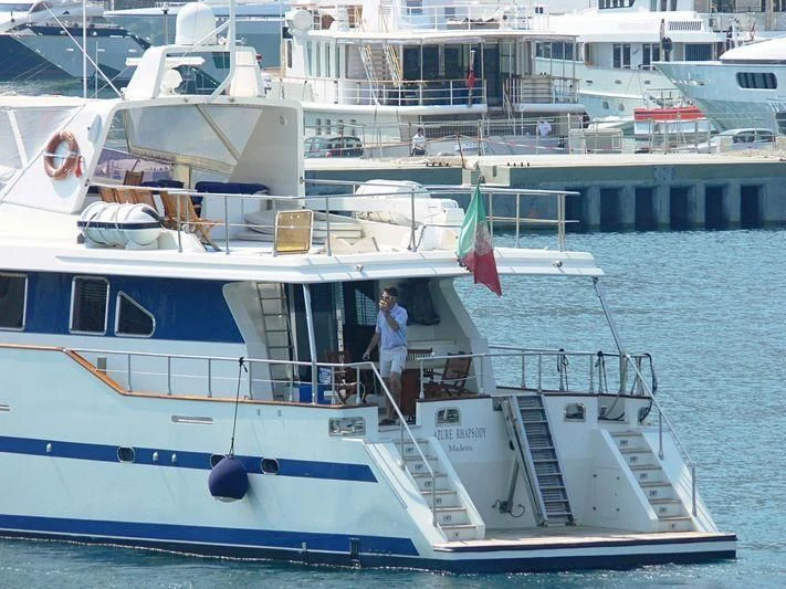 a boat with a person on it aboard AZURE RHAPSODY Yacht for Sale