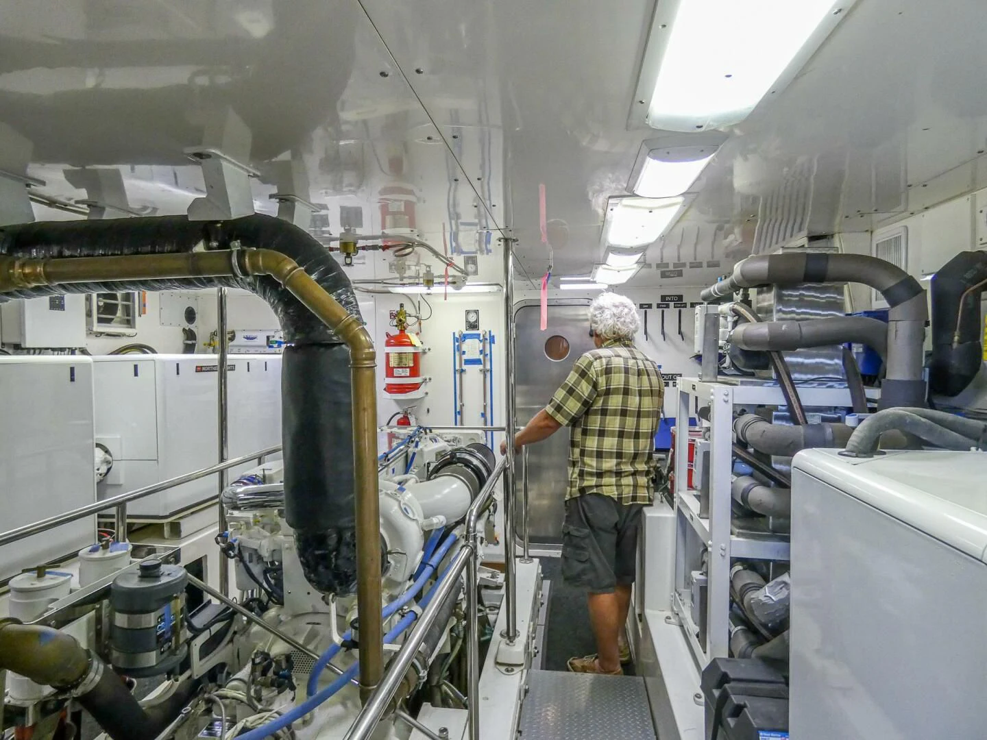 a person in a factory aboard IIWII Yacht for Sale