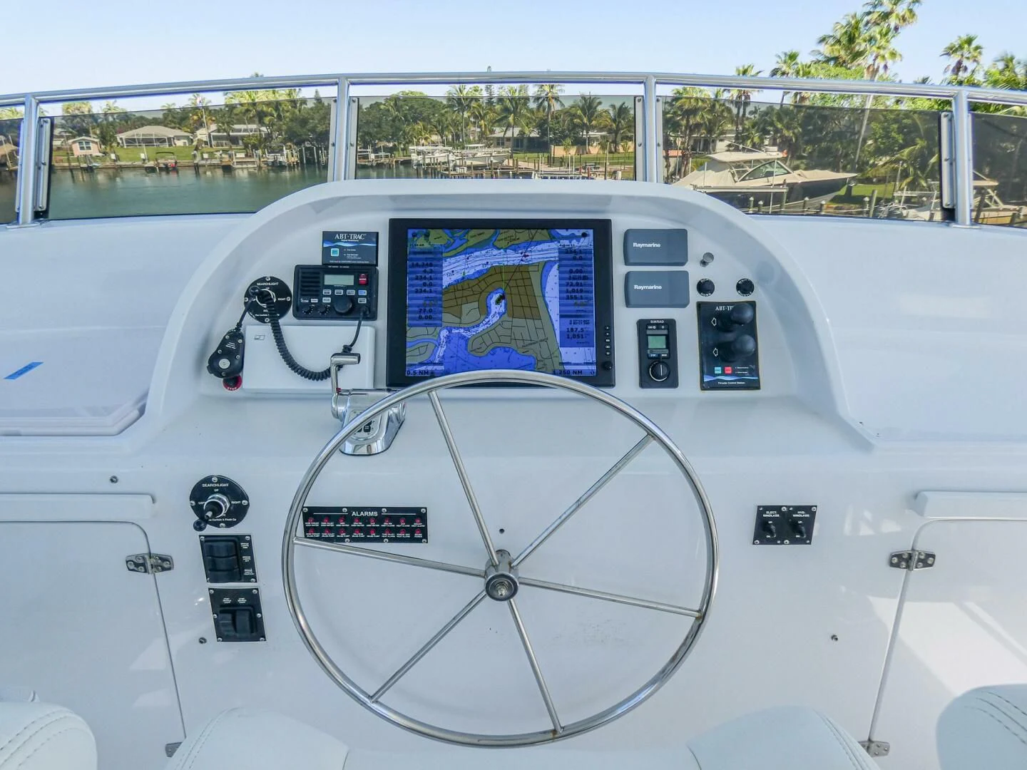 a white vehicle with a screen aboard IIWII Yacht for Sale