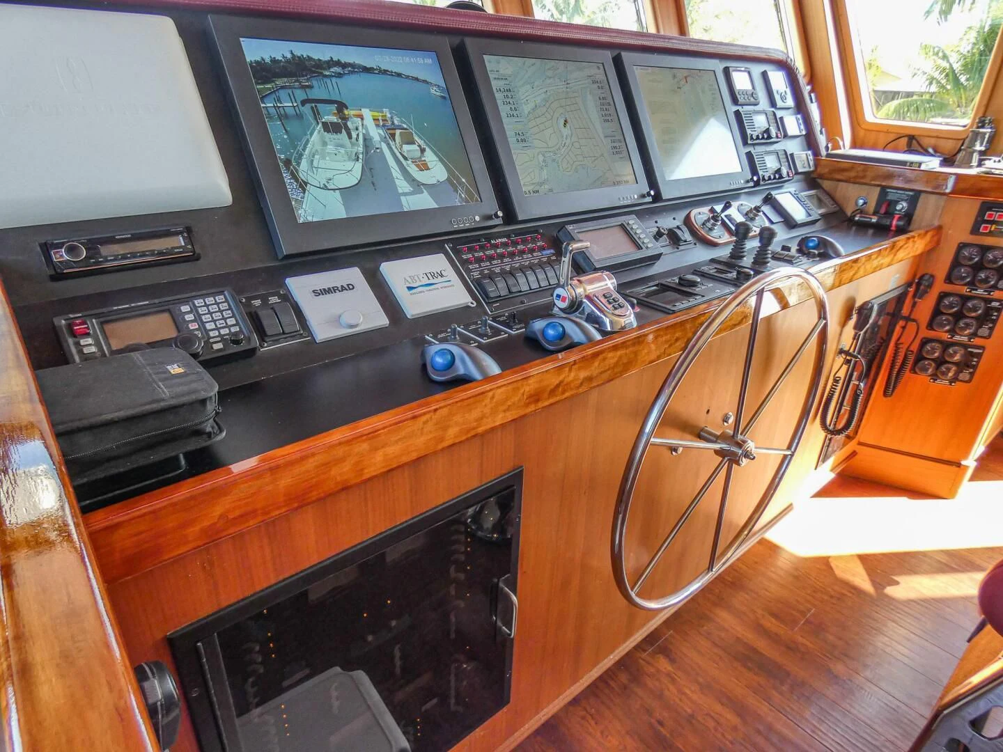 a black microwave oven and a black microwave on a wooden counter aboard IIWII Yacht for Sale