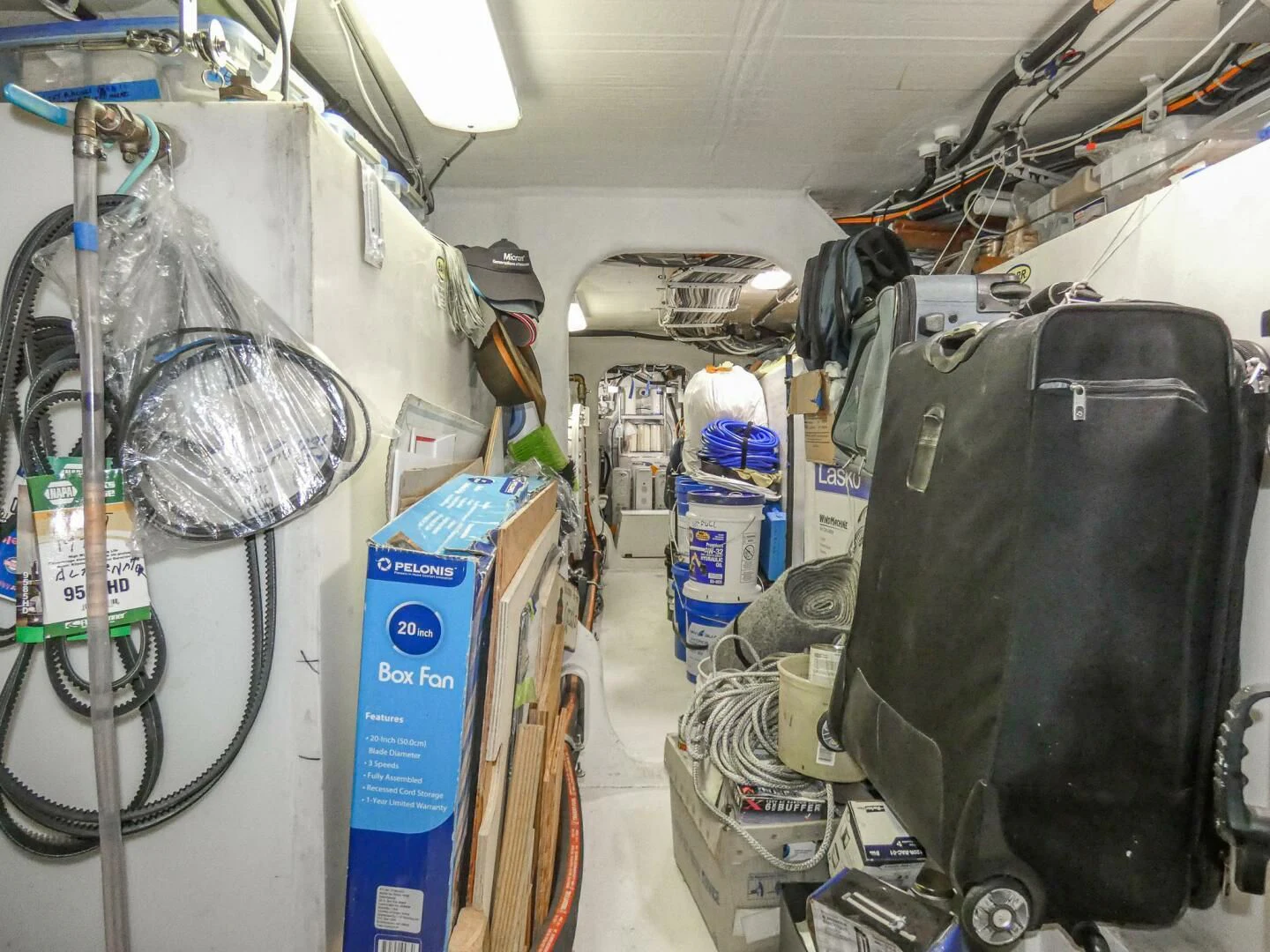 a room full of luggage aboard IIWII Yacht for Sale