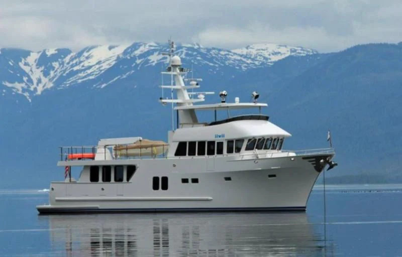 a large white boat in the water aboard IIWII Yacht for Sale