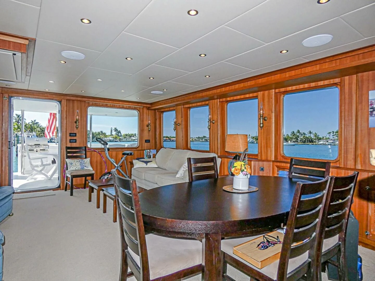 a dining room with a table and chairs aboard IIWII Yacht for Sale