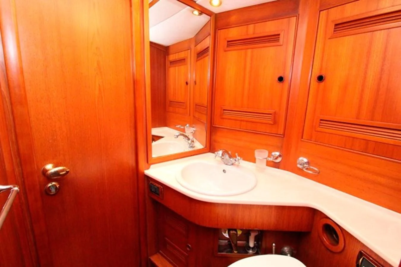a bathroom with a sink and cabinets aboard PLUM Yacht for Sale