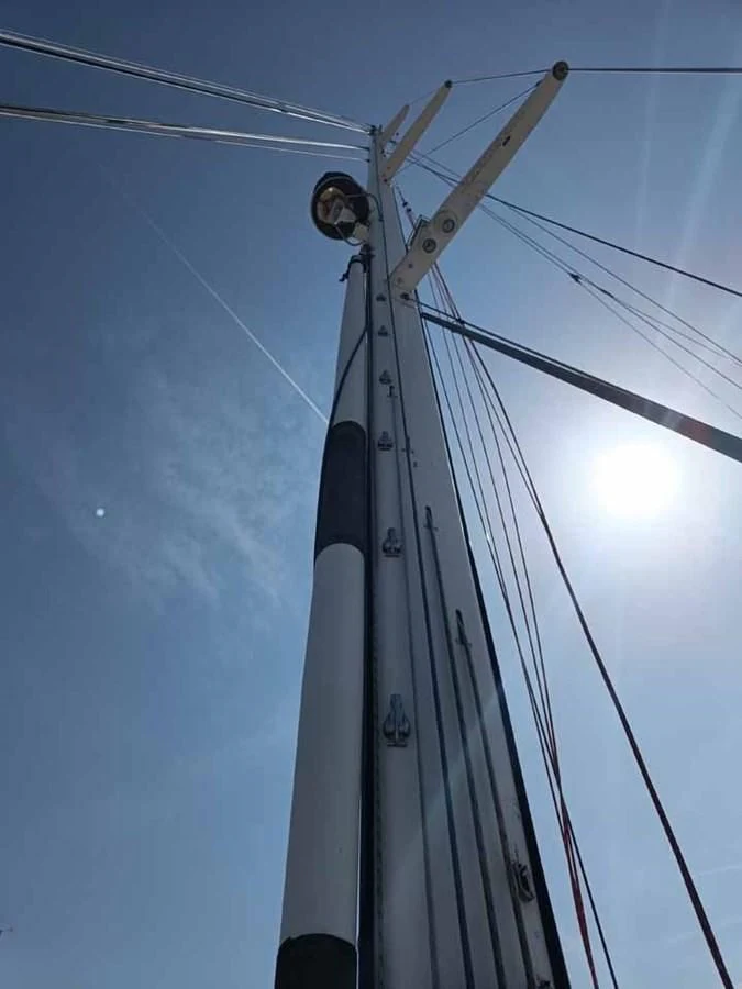 a sailboat with a large sail aboard PLUM Yacht for Sale