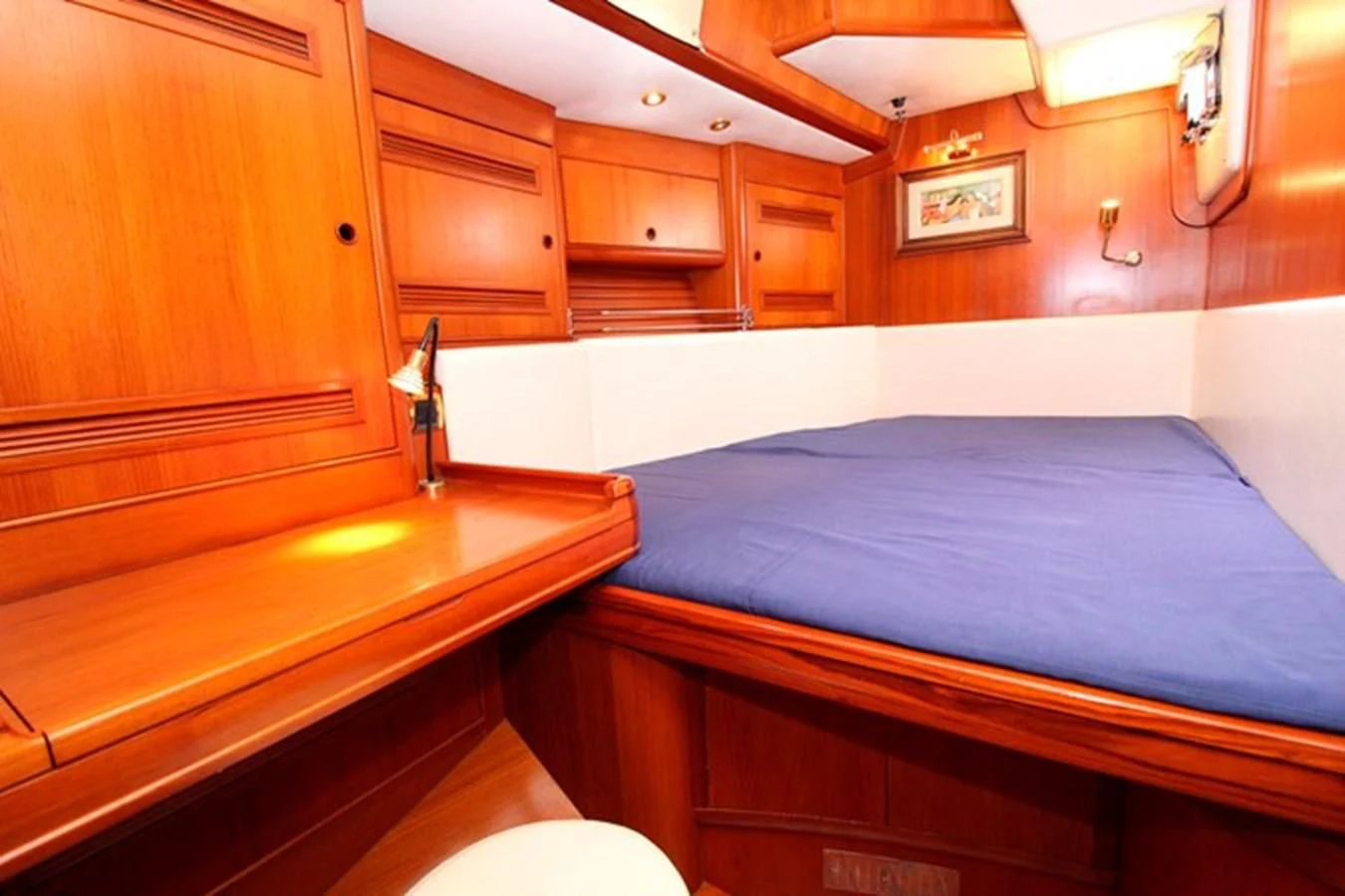a room with wooden cabinets aboard PLUM Yacht for Sale