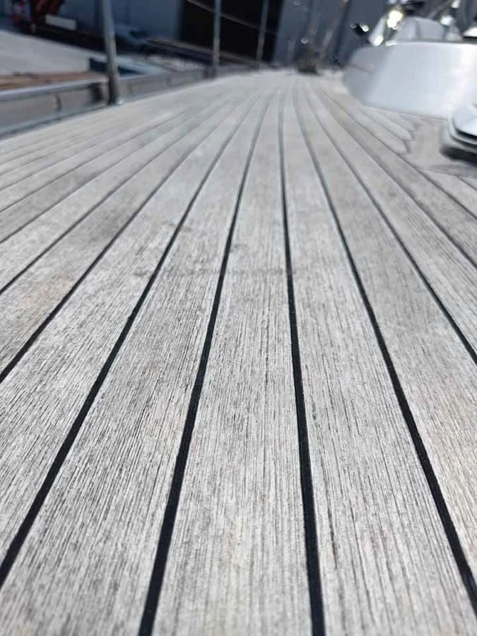 a wooden surface with a light shining on it aboard PLUM Yacht for Sale