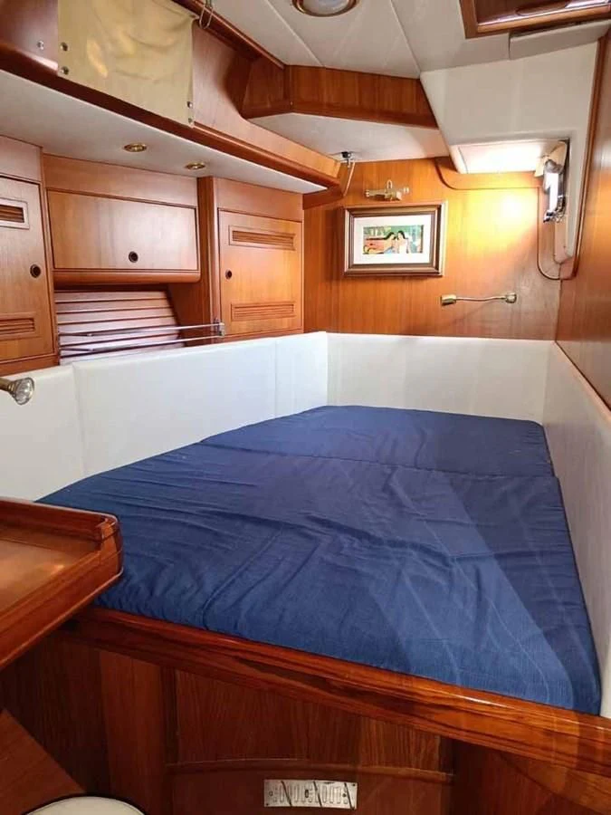 a bed in a room aboard PLUM Yacht for Sale