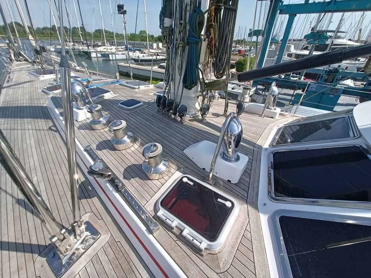 a large white car with a red light on it aboard PLUM Yacht for Sale