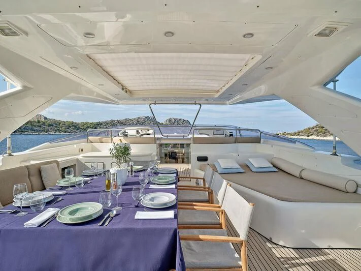 a table set for a meal on a boat aboard PAREAKKI Yacht for Sale