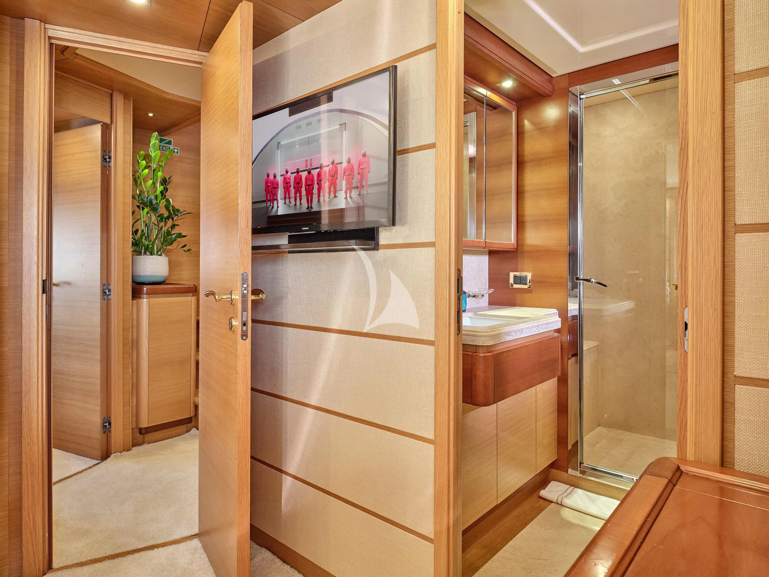 a bathroom with a glass shower aboard PAREAKKI Yacht for Sale