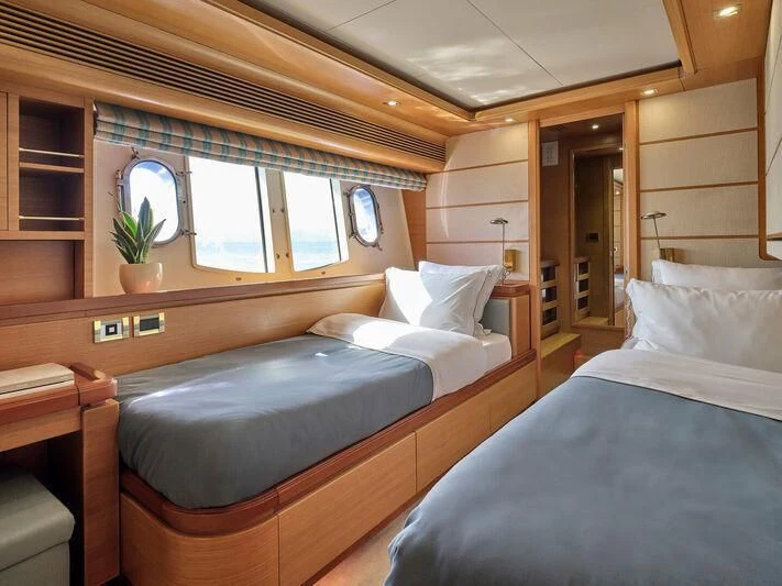 a room with two beds aboard PAREAKKI Yacht for Sale