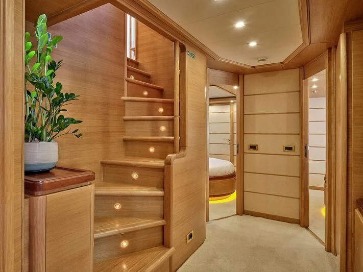 a wood cabinet in a room aboard PAREAKKI Yacht for Sale