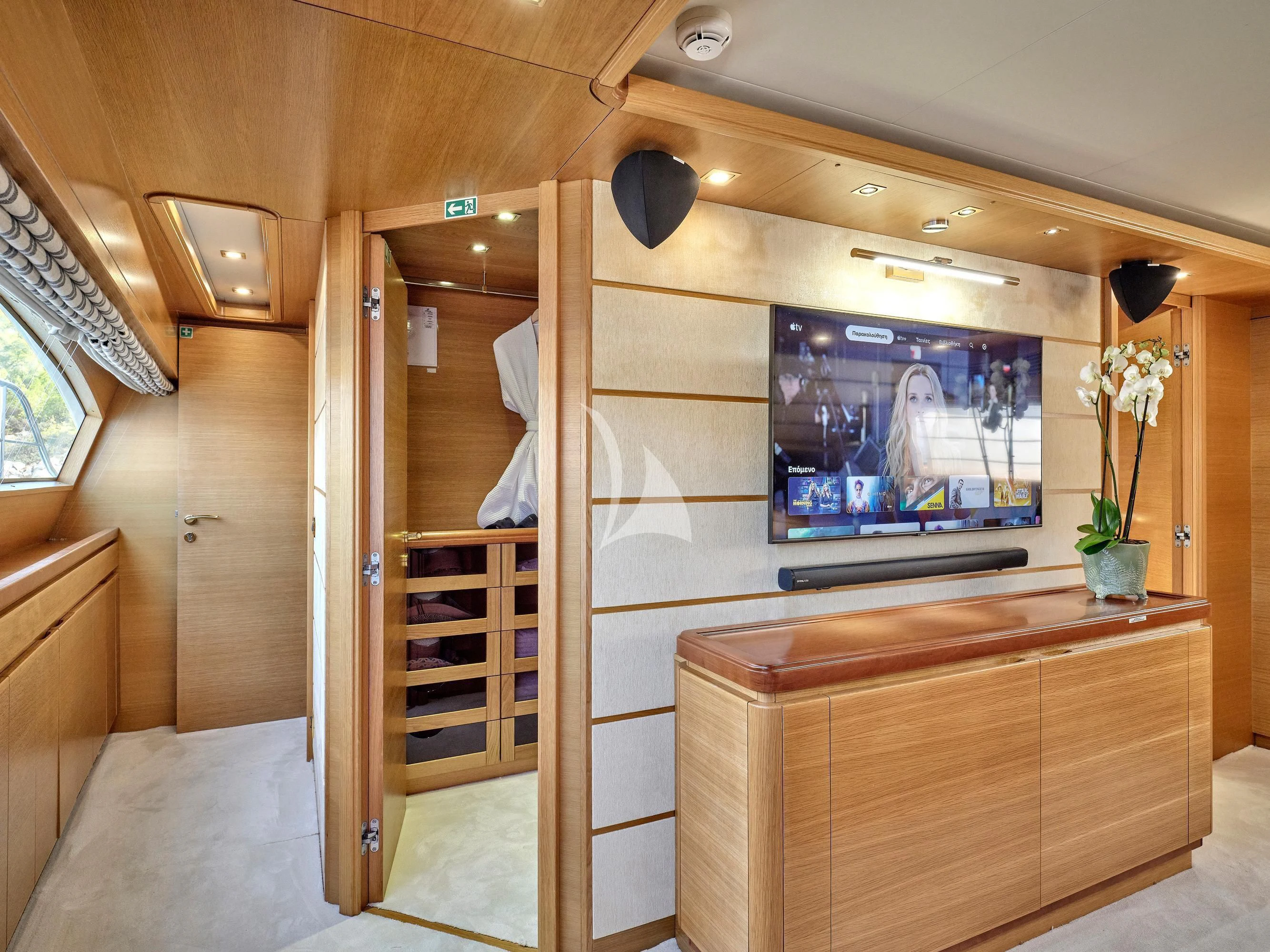 a room with a tv and a door aboard PAREAKKI Yacht for Sale