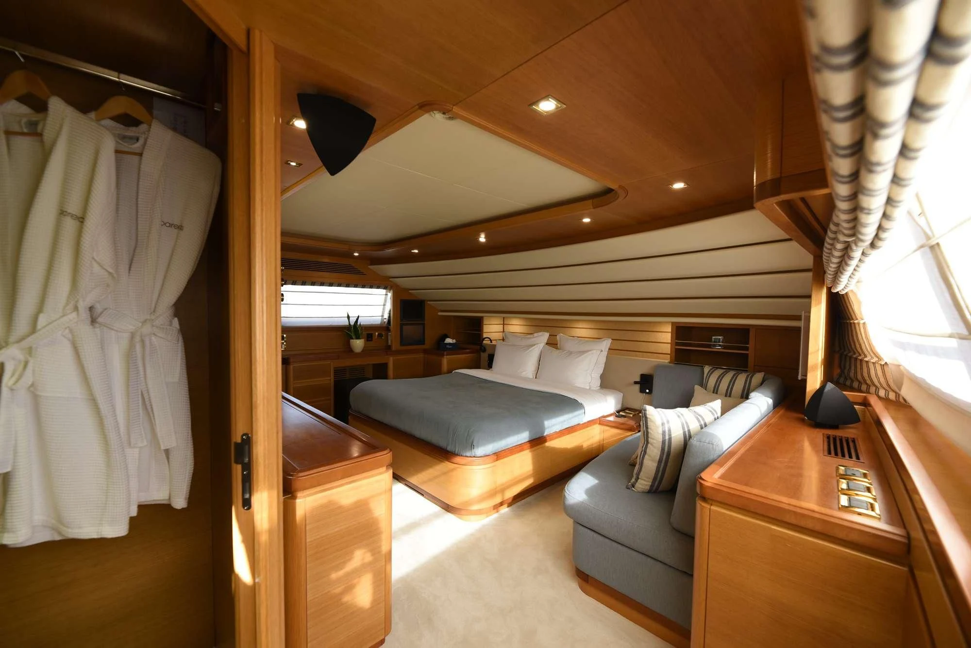 a room with a bed and a desk aboard PAREAKKI Yacht for Sale
