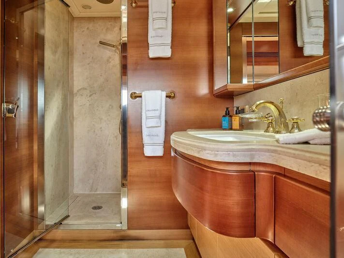 a bathroom with a sink and a mirror aboard PAREAKKI Yacht for Sale