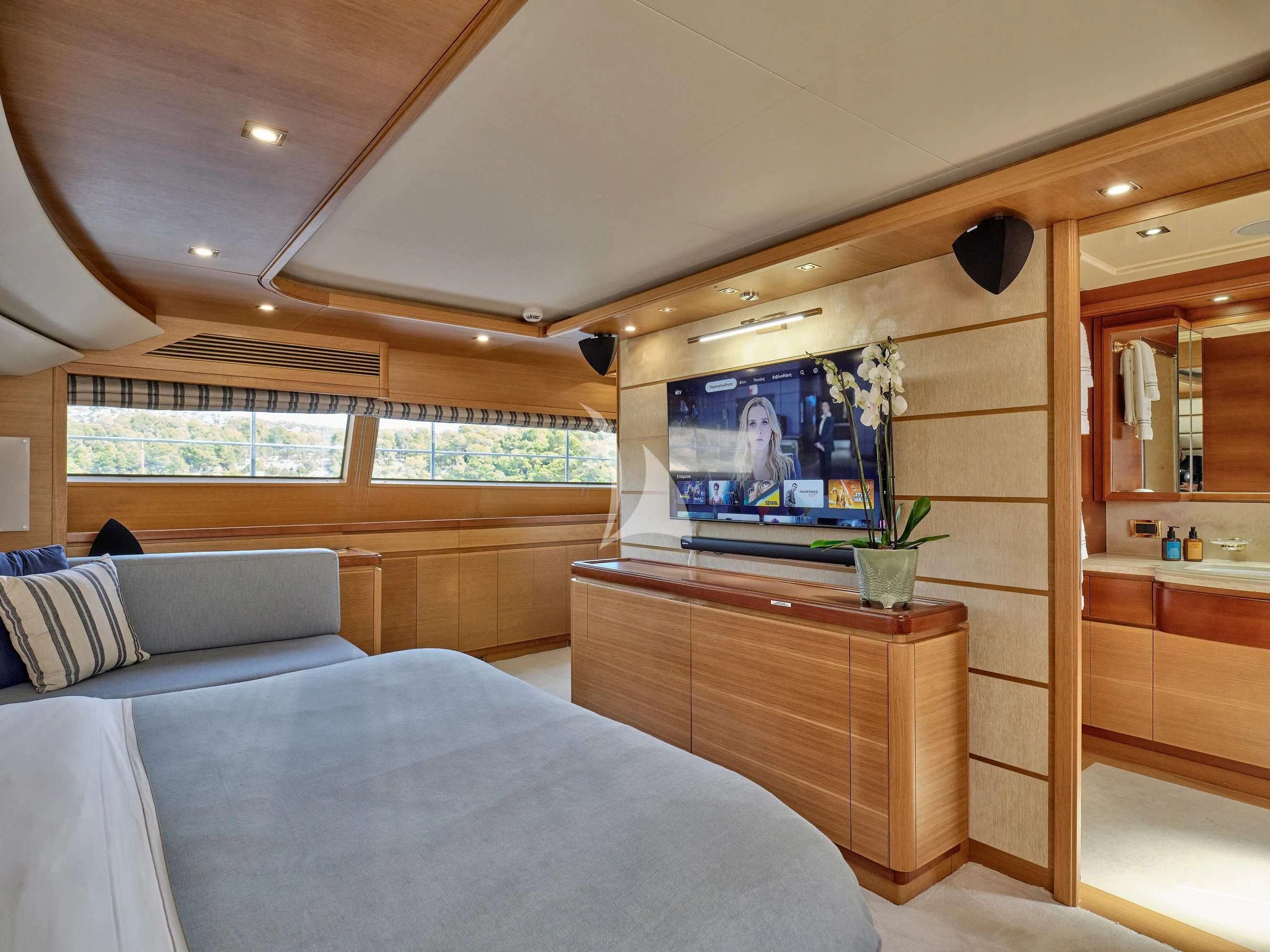 a bedroom with a large tv aboard PAREAKKI Yacht for Sale