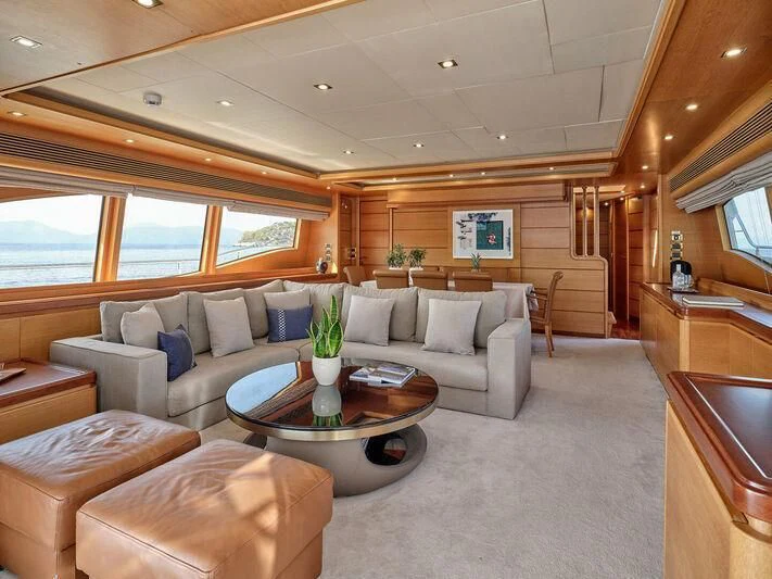 a living room with a couch and a coffee table aboard PAREAKKI Yacht for Sale
