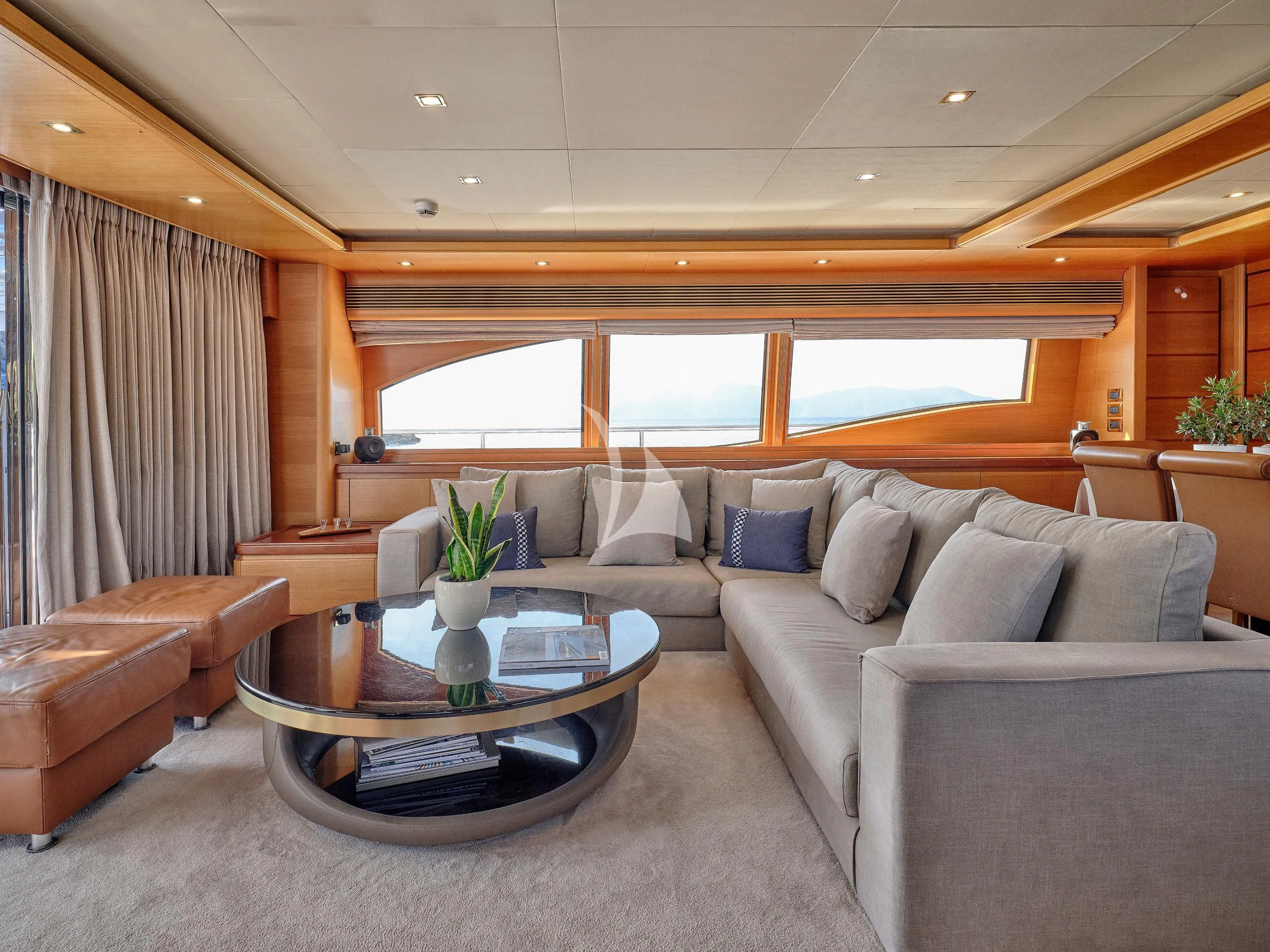 a living room with a couch and a coffee table aboard PAREAKKI Yacht for Sale