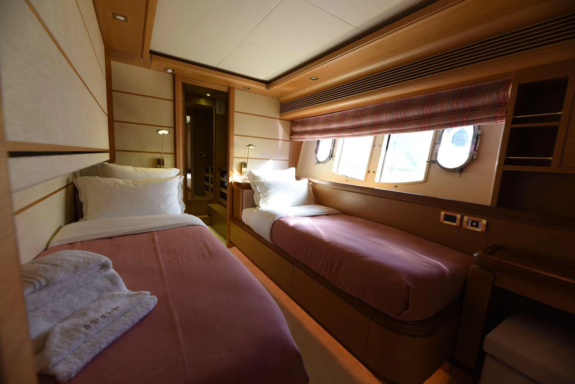 a couple of beds in a room aboard PAREAKKI Yacht for Sale