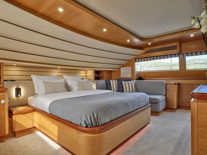 a large bed in a room aboard PAREAKKI Yacht for Sale