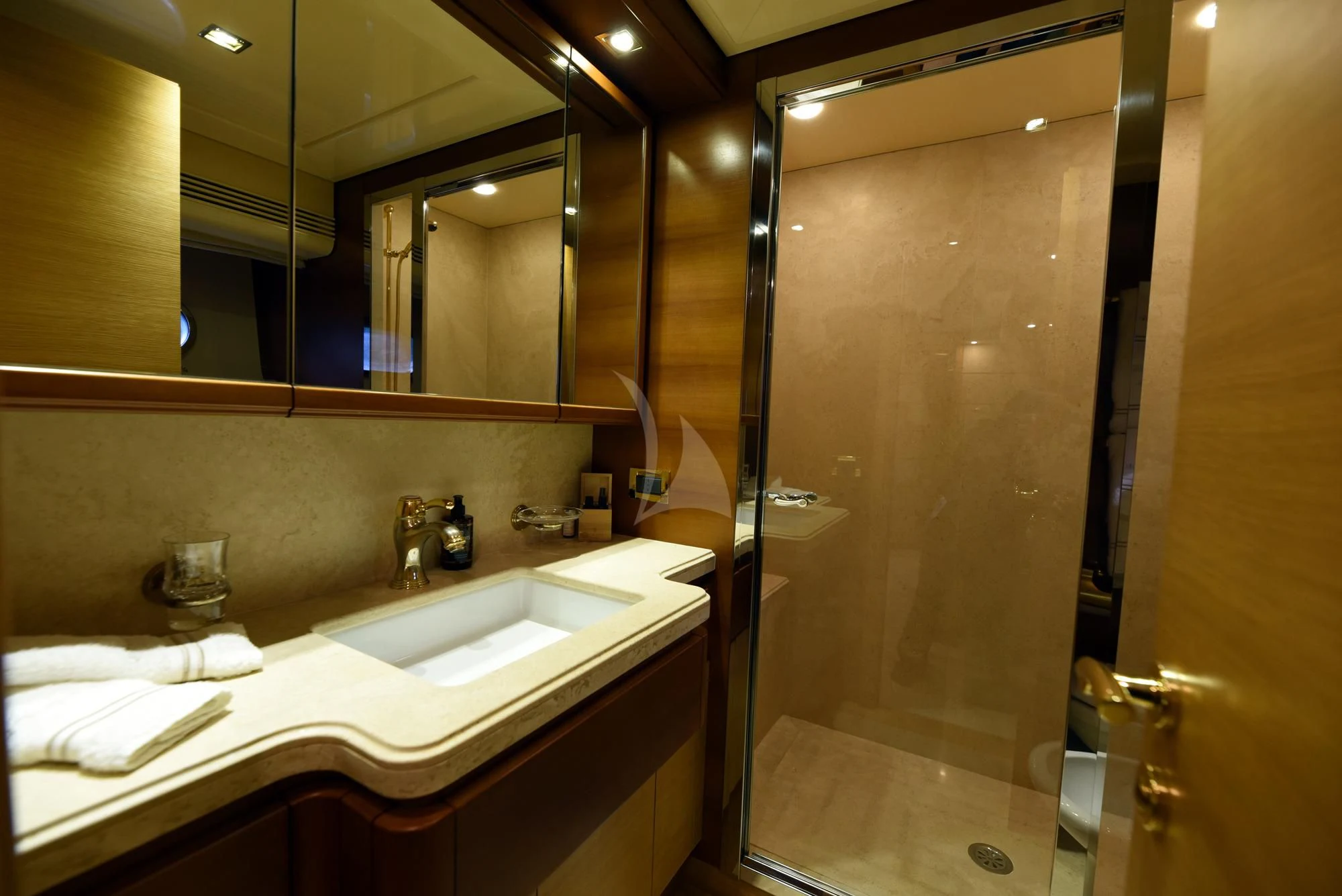 a bathroom with a large mirror aboard PAREAKKI Yacht for Sale