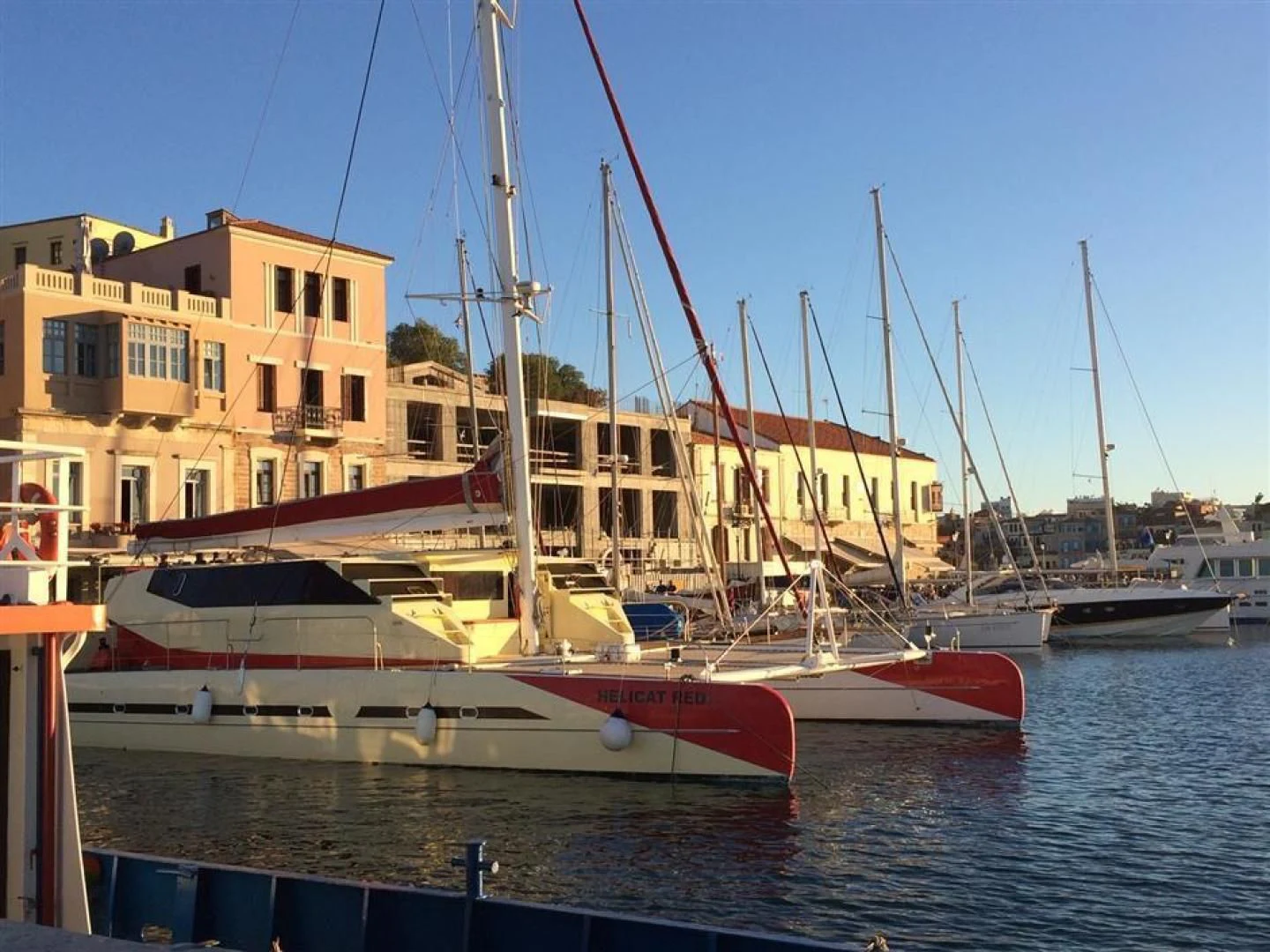 a boat docked at a pier aboard HELICAT RED Yacht for Sale