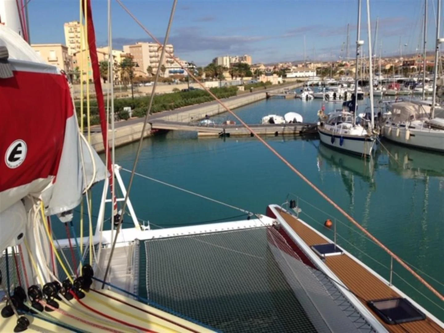 a group of boats are parked in a harbor aboard HELICAT RED Yacht for Sale