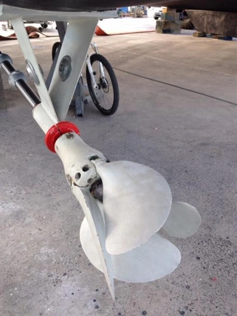 a white robot with a red and black handle aboard HELICAT RED Yacht for Sale