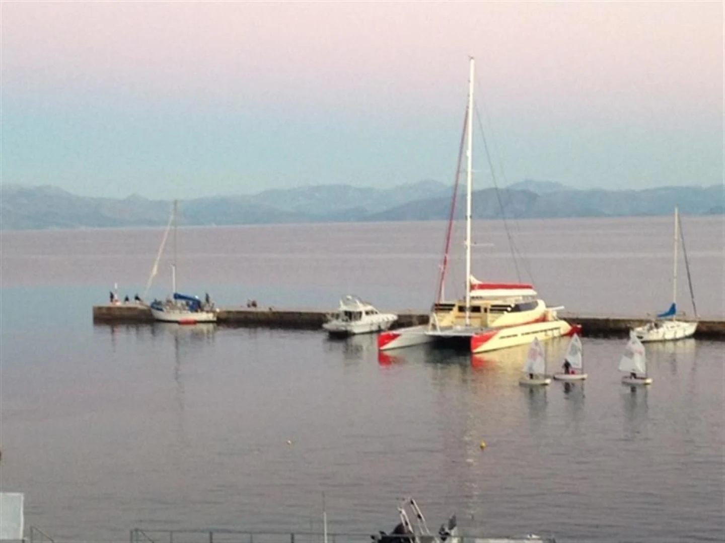 a group of boats in a harbor aboard HELICAT RED Yacht for Sale